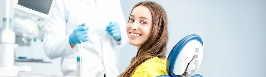 Smiling Woman Getting Some Dental Care Done